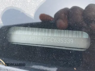 2007 Nissan Pathfinder S z VIN 5N1AR18U77C635339, wystawiony jako IAAI lot #42302964 z przebiegiem Nie podano mil oraz . Historia ofert i sprzedaży dostępna na DreamBid. Obrazek 9.