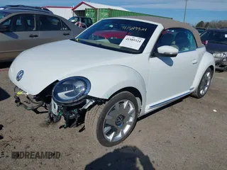 2018 Volkswagen Beetle S with VIN 3VW5DAAT1JM506988, listed as a IAAI auction lot 41589324 with 50,873 mi miles and . Bid and sale history available at DreamBid. Image 2.