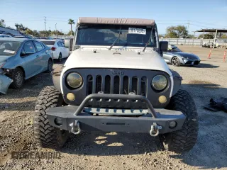 2010 Jeep Wrangler Sport with VIN 1J4AA2D16AL144842, listed as a Copart auction lot 50173535 with 106,000 mi miles and Salvage Title. Bid and sale history available at carsss.com. Image 5.