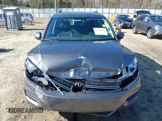 2014 Volkswagen Tiguan SE z VIN WVGAV3AX0EW511694, wystawiony jako IAAI lot #41811345 z przebiegiem 95 129 mil mil oraz . Historia ofert i sprzedaży dostępna na DreamBid. Obrazek 12.