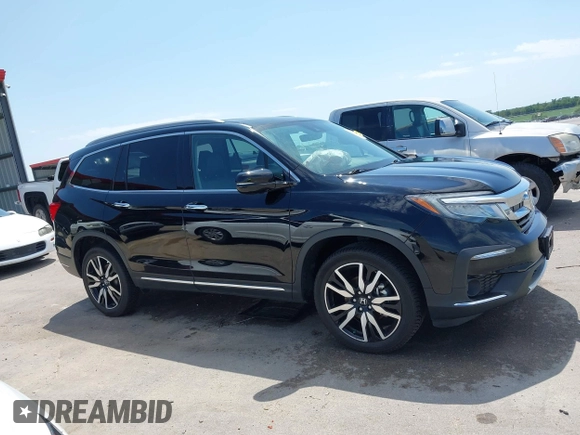 2019 Honda Pilot Touring 7-Passenger with VIN 5FNYF6H67KB031988, listed as a IAAI auction lot 42519588 with 41,368 mi miles and . Bid and sale history available at DreamBid. Image 13.