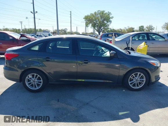 2018 Ford Focus SE z VIN 1FADP3F27JL245603, wystawiony jako IAAI lot #41773395 z przebiegiem 94 044 mil mil oraz . Historia ofert i sprzedaży dostępna na DreamBid. Obrazek 13.