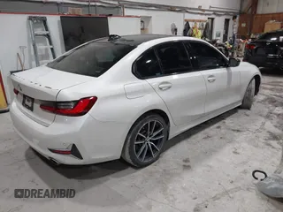 2019 BMW 3 Series 330i xDrive with VIN WBA5R7C55KAJ83482, listed as a IAAI auction lot 41565321 with 126,536 mi miles. Bid and sale history available at carsss.com. Image 4.