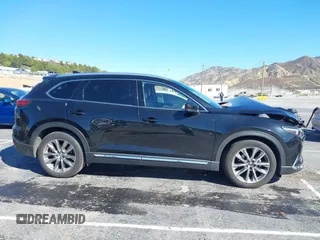 2018 Mazda CX-9 Grand Touring z VIN JM3TCADY8J0221221, wystawiony jako IAAI lot #41644721 z przebiegiem 41 510 mil mil oraz . Historia ofert i sprzedaży dostępna na DreamBid. Obrazek 13.