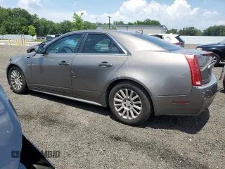 2012 Cadillac CTS Luxury with VIN 1G6DE5E54C0138040, listed as a Copart auction lot 61997305 with 140,996 mi miles and Salvage title. Bid and sale history available at DreamBid. Image 2.