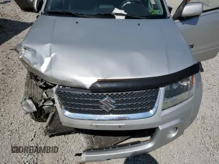 2011 Suzuki Grand Vitara Premium z VIN JS3TD0D29B4103041, wystawiony jako Copart lot #62066985 z przebiegiem 219 727 mil mil oraz Szkoda całkowita • Salvage title. Historia ofert i sprzedaży dostępna na DreamBid. Obrazek 12.