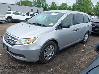 2011 Honda Odyssey LX with VIN 5FNRL5H25BB040287, listed as a IAAI auction lot 42456679 with 129,176 mi miles and . Bid and sale history available at DreamBid. Image 2.