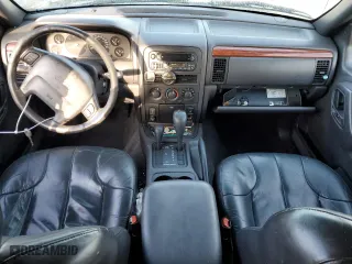 1999 Jeep Grand Cherokee Laredo with VIN 1J4GW58N1XC737706, listed as a Copart auction lot 83107914 with 0 mi miles and Salvage Title. Bid and sale history available at carsss.com. Image 8.