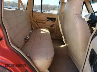 1995 Jeep Cherokee Sport with VIN 1J4FJ68S2SL666126, listed as a Copart auction lot 50496735 with 158,523 mi miles and Salvage title. Bid and sale history available at DreamBid. Image 10.