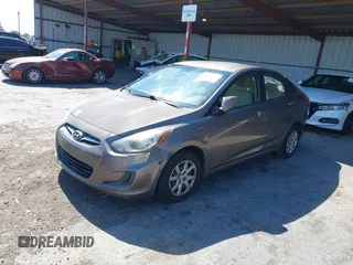 2014 Hyundai Accent GLS z VIN KMHCT4AE9EU671748, wystawiony jako IAAI lot #42356469 z przebiegiem 179 390 mil mil oraz . Historia ofert i sprzedaży dostępna na DreamBid. Obrazek 17.