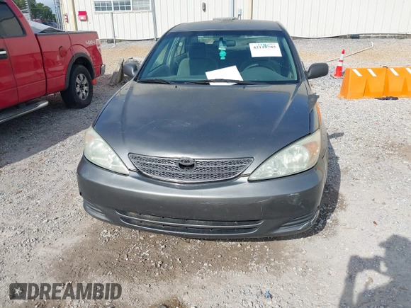 2003 Toyota Camry LE with VIN 4T1BE32K03U727447, listed as a IAAI auction lot 42118785 with 325,881 mi miles and . Bid and sale history available at DreamBid. Image 6.