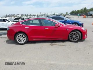 2018 Tesla Model S 75D with VIN 5YJSA1E29JF273494, listed as a IAAI auction lot 42246104 with 93,870 mi miles and . Bid and sale history available at DreamBid. Image 13.