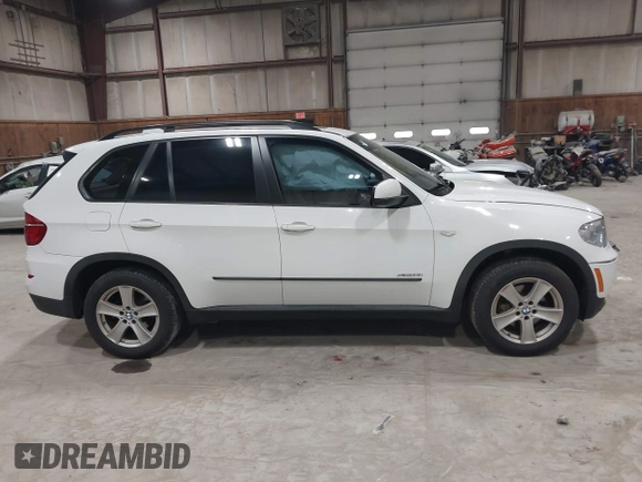 2012 BMW X5 35i z VIN 5UXZV4C54CL748257, wystawiony jako IAAI lot #42036669 z przebiegiem 122 438 mil mil oraz . Historia ofert i sprzedaży dostępna na DreamBid. Obrazek 13.
