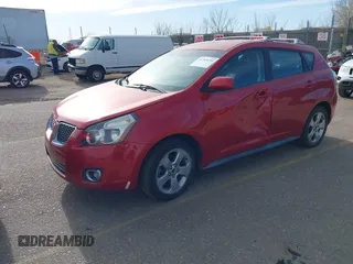 2009 Pontiac Vibe with VIN 5Y2SM67009Z401692, listed as a IAAI auction lot 41769199 with 143,904 mi miles. Bid and sale history available at carsss.com. Image 2.