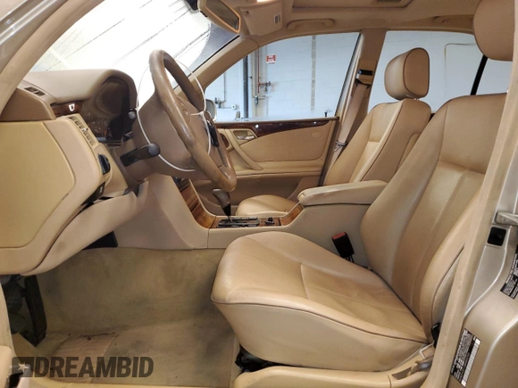 2002 Mercedes-Benz E-Class with VIN WDBJF65J12B485293, listed as a Copart auction lot 77561984 with 140,708 mi miles and Salvage Title. Bid and sale history available at carsss.com. Image 7.