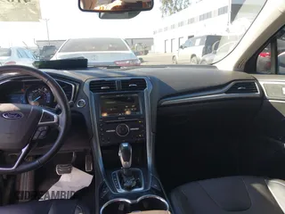 2016 Ford Fusion Titanium Hybrid with VIN 3FA6P0RU1GR259947, listed as a IAAI auction lot 41695377 with 97,605 mi miles. Bid and sale history available at carsss.com. Image 22.