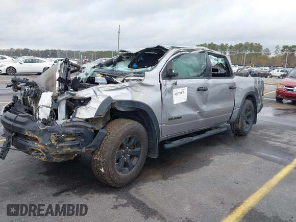 2021 Ram 1500 Rebel with VIN 1C6SRFLT0MN734774, listed as a IAAI auction lot 41075676 with 95,808 mi miles and . Bid and sale history available at DreamBid. Image 2.