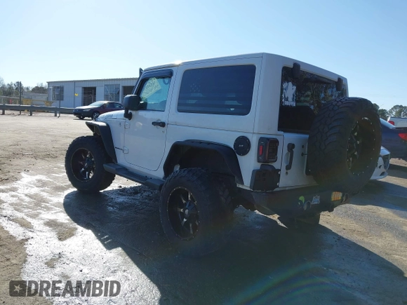 2014 Jeep Wrangler Sport with VIN 1C4AJWAG0EL245337, listed as a IAAI auction lot 41532314 with 140,721 mi miles and . Bid and sale history available at DreamBid. Image 3.