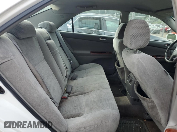 2004 Toyota Camry LE z VIN 4T1BE30K04U301360, wystawiony jako Copart lot #60804115 z przebiegiem 287 009 mil mil oraz Szkoda całkowita • Salvage title. Historia ofert i sprzedaży dostępna na DreamBid. Obrazek 10.