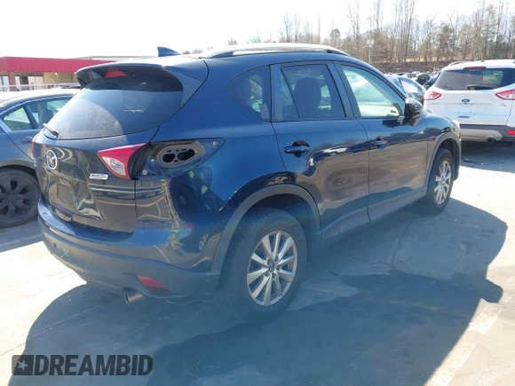2016 Mazda CX-5 Touring with VIN JM3KE4CY0G0631786, listed as a IAAI auction lot 41761214 with 220,058 mi miles. Bid and sale history available at carsss.com. Image 4.