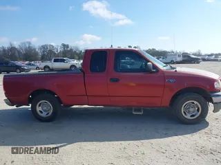 2000 Ford F-150 XL with VIN 1FTZX1729YNC32076, listed as a IAAI auction lot 41523364 with 216,726 mi miles. Bid and sale history available at carsss.com. Image 13.