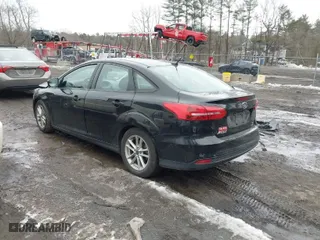 2016 Ford Focus SE with VIN 1FADP3FE7GL236032, listed as a IAAI auction lot 41597830 with 116,312 mi miles. Bid and sale history available at carsss.com. Image 3.