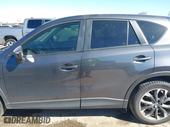 2016 Mazda CX-5 Grand Touring with VIN JM3KE2DYXG0784615, listed as a IAAI auction lot 41846853 with 72,185 mi miles. Bid and sale history available at carsss.com. Image 14.