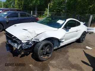 2021 Ford Mustang EcoBoost with VIN 1FA6P8TH6M5148562, listed as a IAAI auction lot 42147236 with 57,050 mi miles and . Bid and sale history available at DreamBid. Image 2.