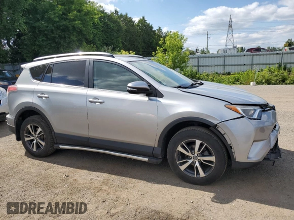 2018 Toyota RAV4 LE with VIN 2T3BFREV8JW788362, listed as a Copart auction lot 64053735 with 124,668 mi miles and Salvage title. Bid and sale history available at DreamBid. Image 4.