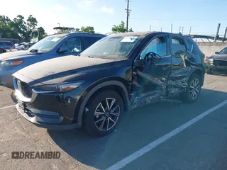 2018 Mazda CX-5 Grand Touring with VIN JM3KFBDM1J0345014, listed as a IAAI auction lot 42703926 with 151,453 mi miles and . Bid and sale history available at DreamBid. Image 17.