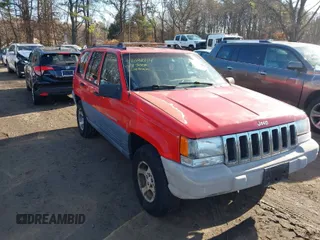 1997 Jeep Grand Cherokee Laredo with VIN 1J4GZ58S0VC550242, listed as a IAAI auction lot 41032114 with 185,307 mi miles. Bid and sale history available at carsss.com. Image 1.