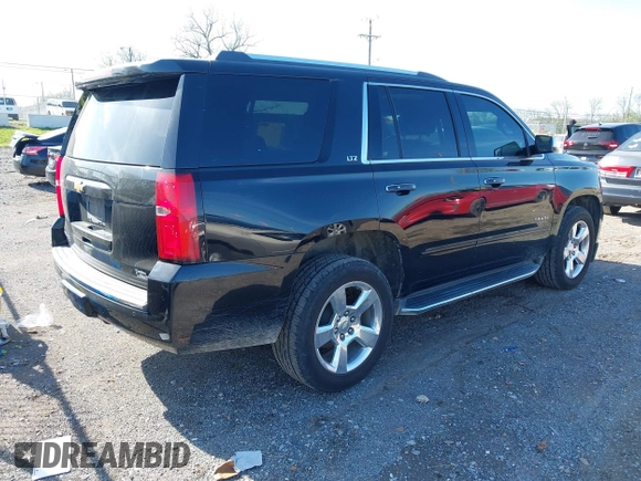 2016 Chevrolet Tahoe LTZ with VIN 1GNSCCKC2GR126687, listed as a IAAI auction lot 41952725 with 202,016 mi miles and . Bid and sale history available at DreamBid. Image 4.