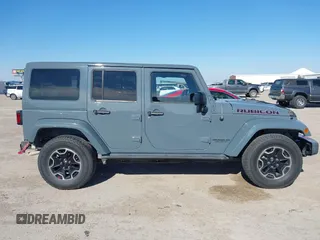 2015 Jeep Wrangler Unlimited Rubicon with VIN 1C4BJWFG7FL525724, listed as a IAAI auction lot 41394059 with 132,058 mi miles. Bid and sale history available at carsss.com. Image 14.