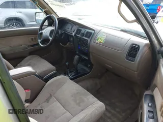 1999 Toyota 4Runner SR5 z VIN JT3HN86R0X0196528, wystawiony jako IAAI lot #41666499 z przebiegiem 294 216 mil mil oraz . Historia ofert i sprzedaży dostępna na DreamBid. Obrazek 5.