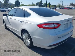2016 Ford Fusion SE Hybrid with VIN 3FA6P0LU1GR385184, listed as a IAAI auction lot 39230513 with 106,311 mi miles. Bid and sale history available at carsss.com. Image 3.