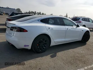 2019 Tesla Model S 100D with VIN 5YJSA1E44KF335113, listed as a Copart auction lot 82936844 with 89,770 mi miles and Salvage title. Bid and sale history available at DreamBid. Image 3.