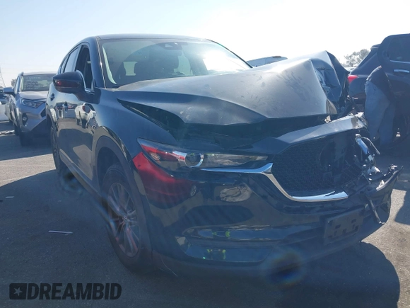 2017 Mazda CX-5 Touring with VIN JM3KFACL2H0146213, listed as a IAAI auction lot 41626112 with 77,829 mi miles and . Bid and sale history available at carsss.com. Image 1.