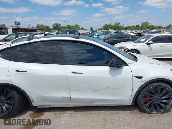 2021 Tesla Model Y Performance with VIN 5YJYGDEF9MF081798, listed as a IAAI auction lot 42033358 with 64,679 mi miles and . Bid and sale history available at DreamBid. Image 14.