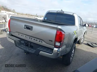 2018 Toyota Tacoma SR5 with VIN 5TFAZ5CN6JX057889, listed as a IAAI auction lot 41449604 with 114,888 mi miles and . Bid and sale history available at DreamBid. Image 4.