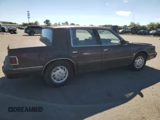 1989 Dodge Dynasty z VIN 1B3BC4637KD532206, wystawiony jako Copart lot #74233744 z przebiegiem 85 245 mil mil oraz Czysty tytuł • Clean title. Historia ofert i sprzedaży dostępna na DreamBid. Obrazek 3.