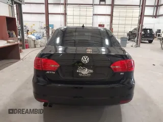 2014 Volkswagen Jetta SE with VIN 3VWD17AJ7EM409189, listed as a IAAI auction lot 42313804 with 139,950 mi miles and . Bid and sale history available at DreamBid. Image 16.