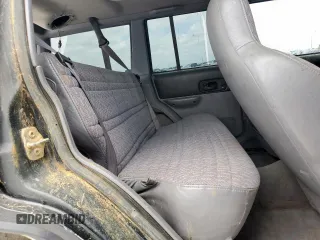 1998 Jeep Cherokee Sport z VIN 1J4FJ68S8WL193483, wystawiony jako Copart lot #58368705 z przebiegiem 94 462 mil mil oraz Szkoda całkowita • Salvage title. Historia ofert i sprzedaży dostępna na DreamBid. Obrazek 11.