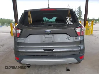 2017 Ford Escape SE z VIN 1FMCU9G93HUC97081, wystawiony jako IAAI lot #42327866 z przebiegiem 97 580 mil mil oraz . Historia ofert i sprzedaży dostępna na DreamBid. Obrazek 16.