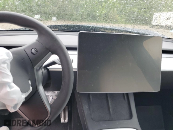 2022 Tesla Model Y Long Range z VIN 7SAYGDEE6NF318808, wystawiony jako Copart lot #57219915 z przebiegiem Nie podano mil oraz Szkoda całkowita • Salvage title. Historia ofert i sprzedaży dostępna na DreamBid. Obrazek 9.