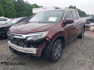 2020 Honda Ridgeline RTL-E with VIN 5FPYK3F7XLB012298, listed as a IAAI auction lot 42230880 with 48,252 mi miles and . Bid and sale history available at DreamBid. Image 2.