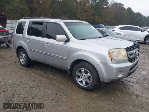 2010 Honda Pilot Touring with VIN 5FNYF3H89AB005861, listed as a IAAI auction lot 40828747 with 275,757 mi miles and . Bid and sale history available at DreamBid. Image 1.