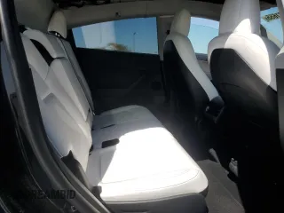 2023 Tesla Model Y Long Range with VIN 7SAYGAEE0PF642810, listed as a Copart auction lot 52181655 with 74,922 mi miles and Salvage Title. Bid and sale history available at DreamBid. Image 11.