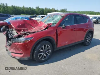 2018 Mazda CX-5 Grand Touring z VIN JM3KFBDM1J0432122, wystawiony jako Copart lot #59135035 z przebiegiem Nie podano mil oraz Szkoda całkowita • Salvage title. Historia ofert i sprzedaży dostępna na DreamBid. Obrazek 1.