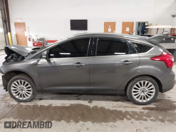 2012 Ford Focus Titanium with VIN 1FAHP3N27CL313288, listed as a IAAI auction lot 41741895 with 140,376 mi miles and . Bid and sale history available at carsss.com. Image 15.