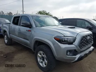 2023 Toyota Tacoma SR z VIN 3TMCZ5AN0PM538974, wystawiony jako IAAI lot #42510020 z przebiegiem 31 281 mil mil oraz . Historia ofert i sprzedaży dostępna na DreamBid. Obrazek 1.